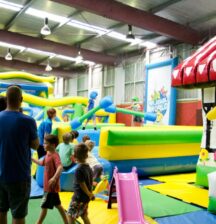 a room full of inflatable toys and climbing activities
